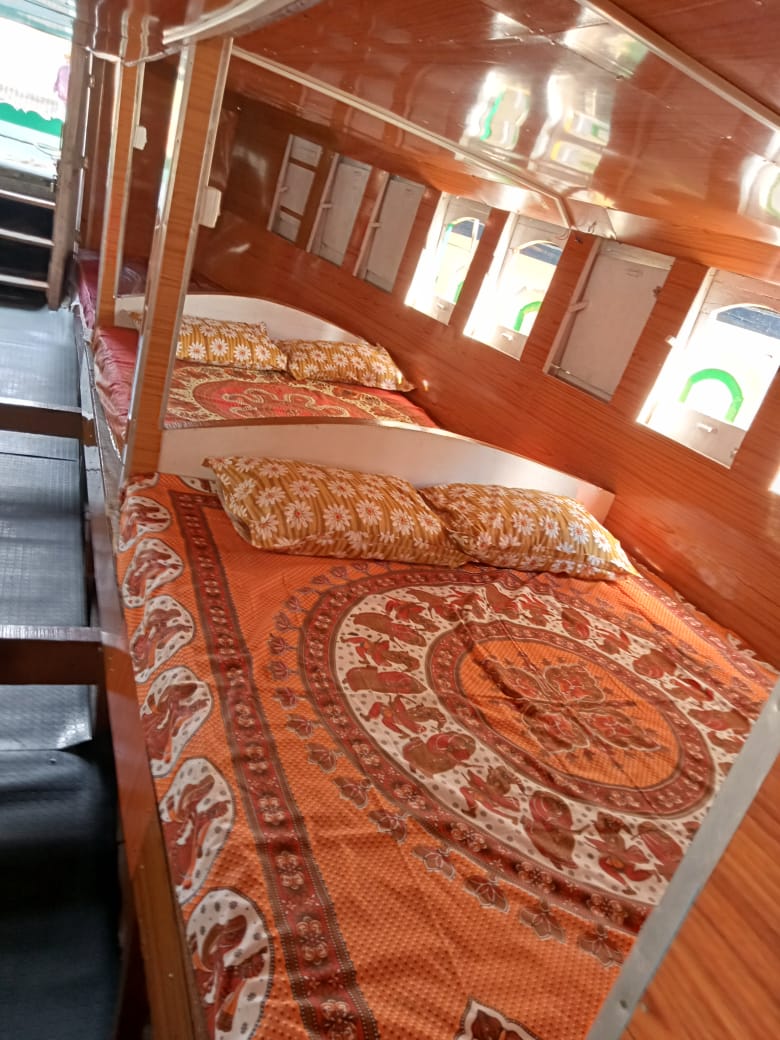 Made-up berths with pillows inside the boat cabin