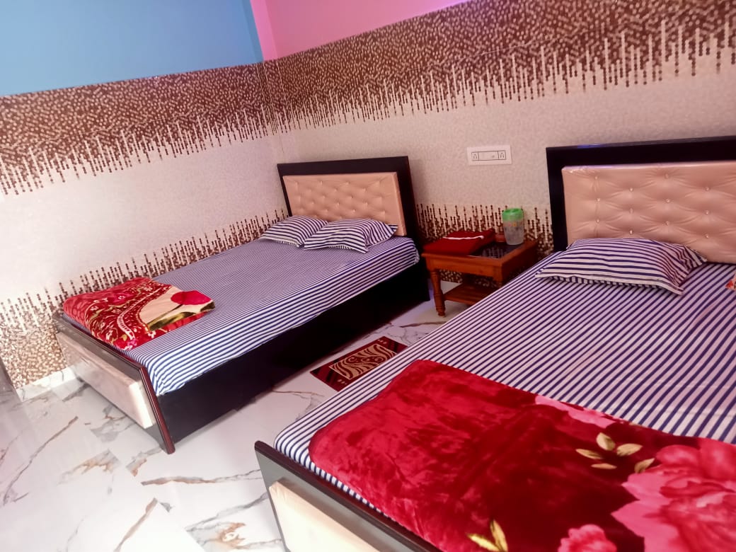 Family room with two beds and fresh bed linen