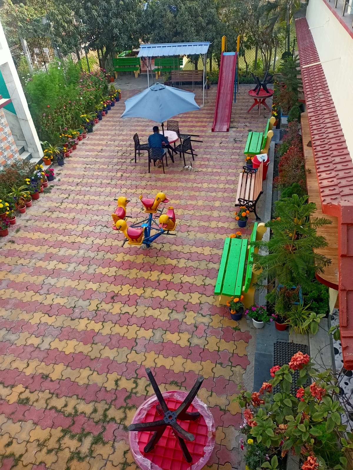 Garden view of the property with flower pots and seating