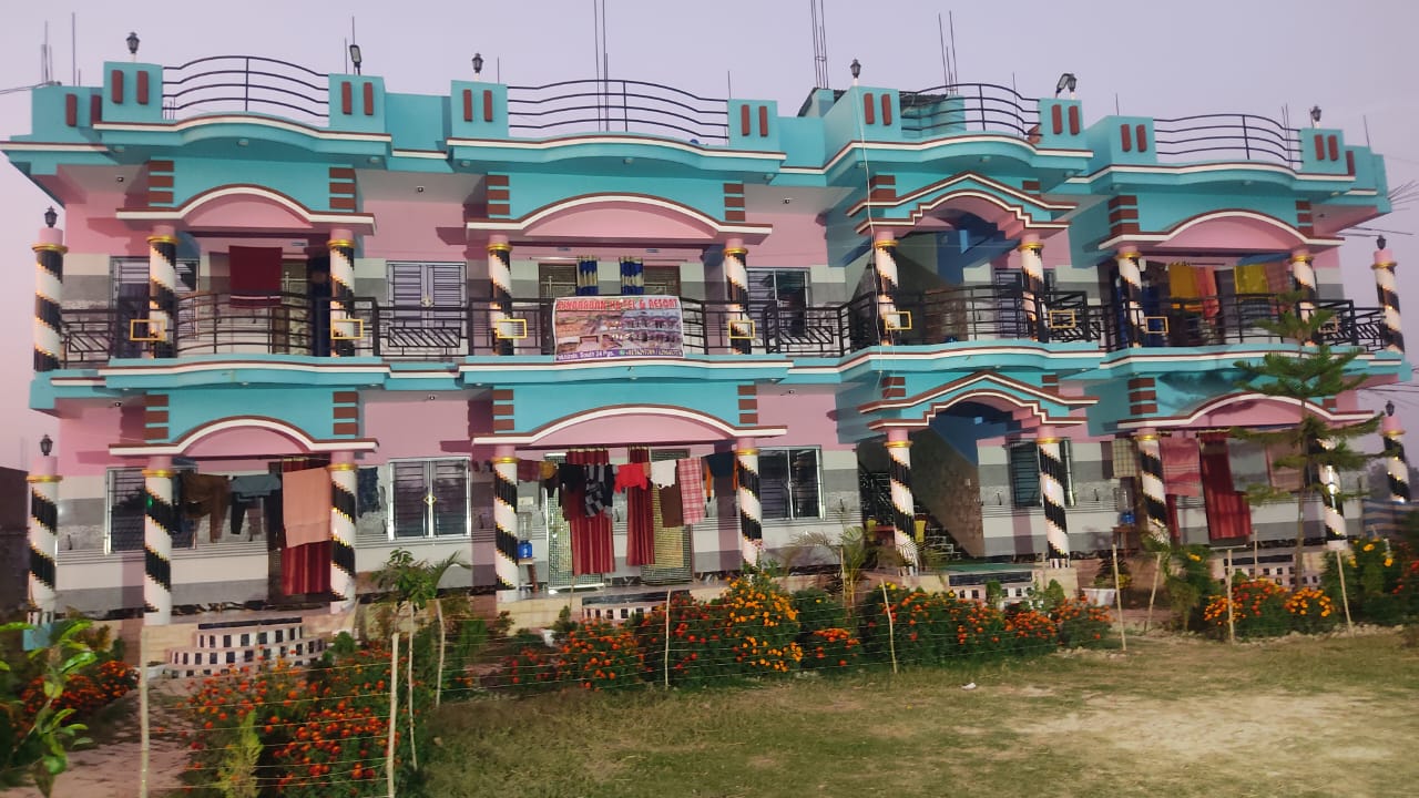 Side view of the homestay building with garden