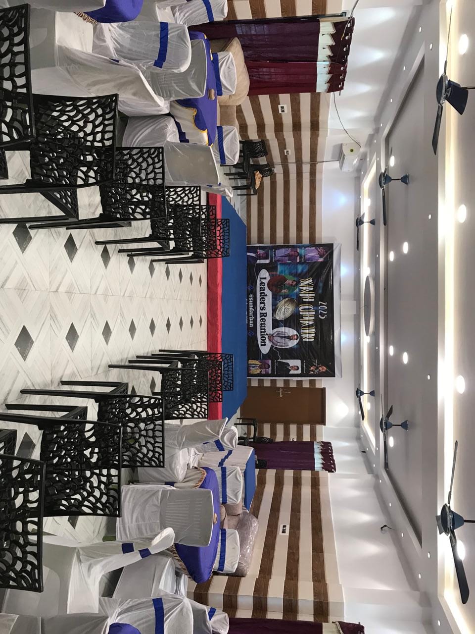 Large dining and event hall arranged for a group gathering